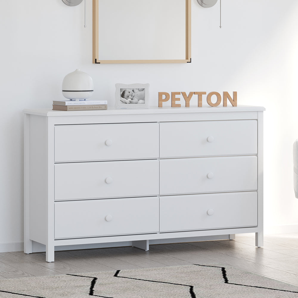 White 6 drawer dresser in nursery