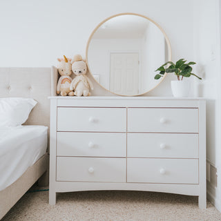 White 6 drawer dresser in nursery