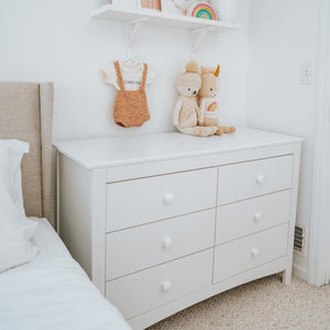 White 6 drawer dresser in nursery