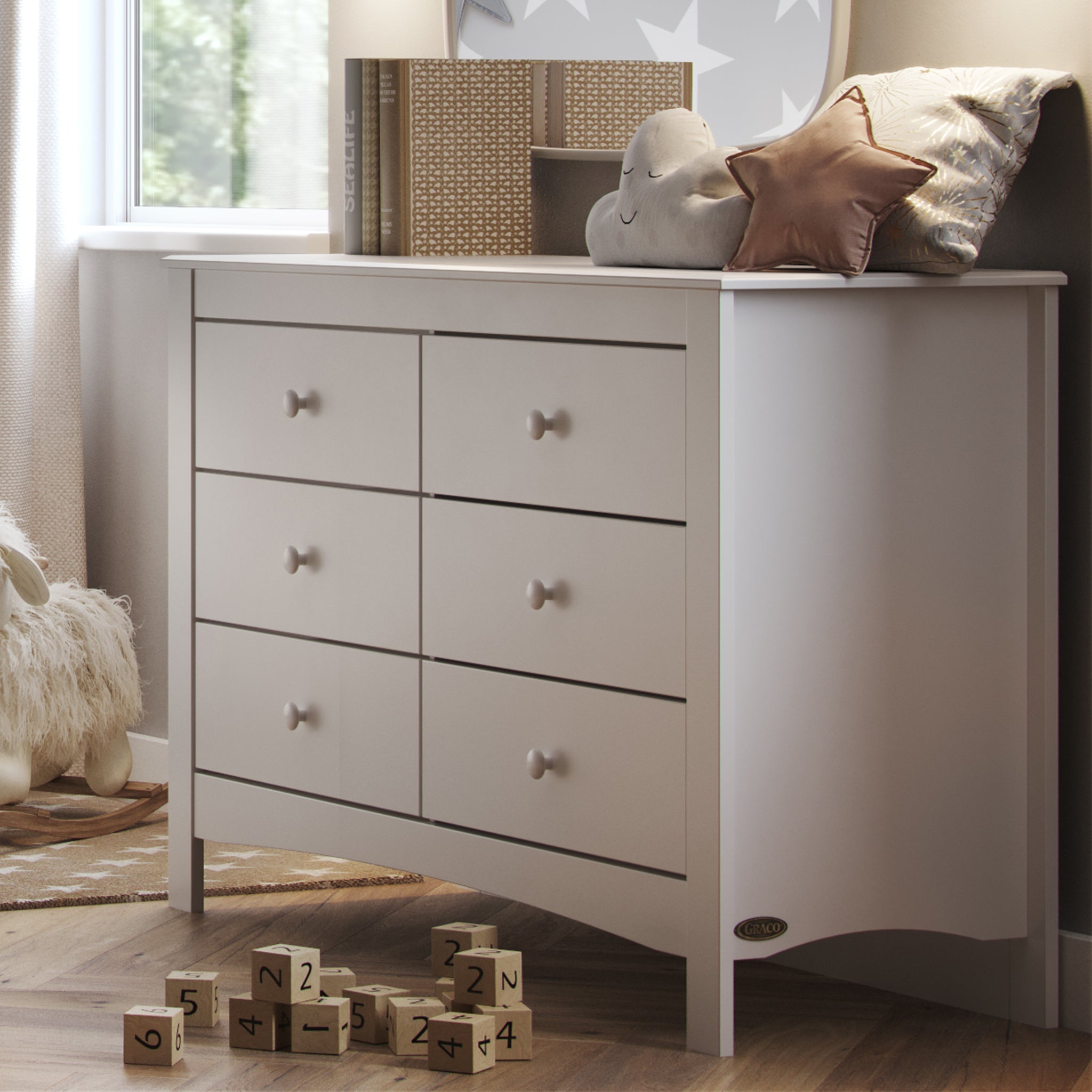 White 6 drawer dresser in nursery