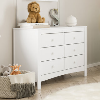 White 6 drawer dresser in nursery