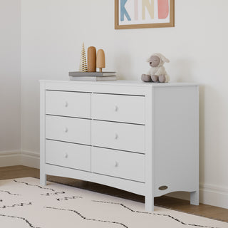 White 6 drawer dresser in nursery