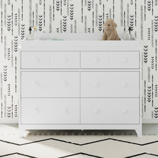 Front view of white 6 drawer dresser in nursery with changing topper