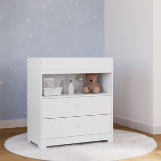 white chest with changing topper in nursery