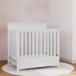 Storkcraft® Petal 4-in-1 Convertible Mini Crib with Bonus Water-Resistant Mattress.
