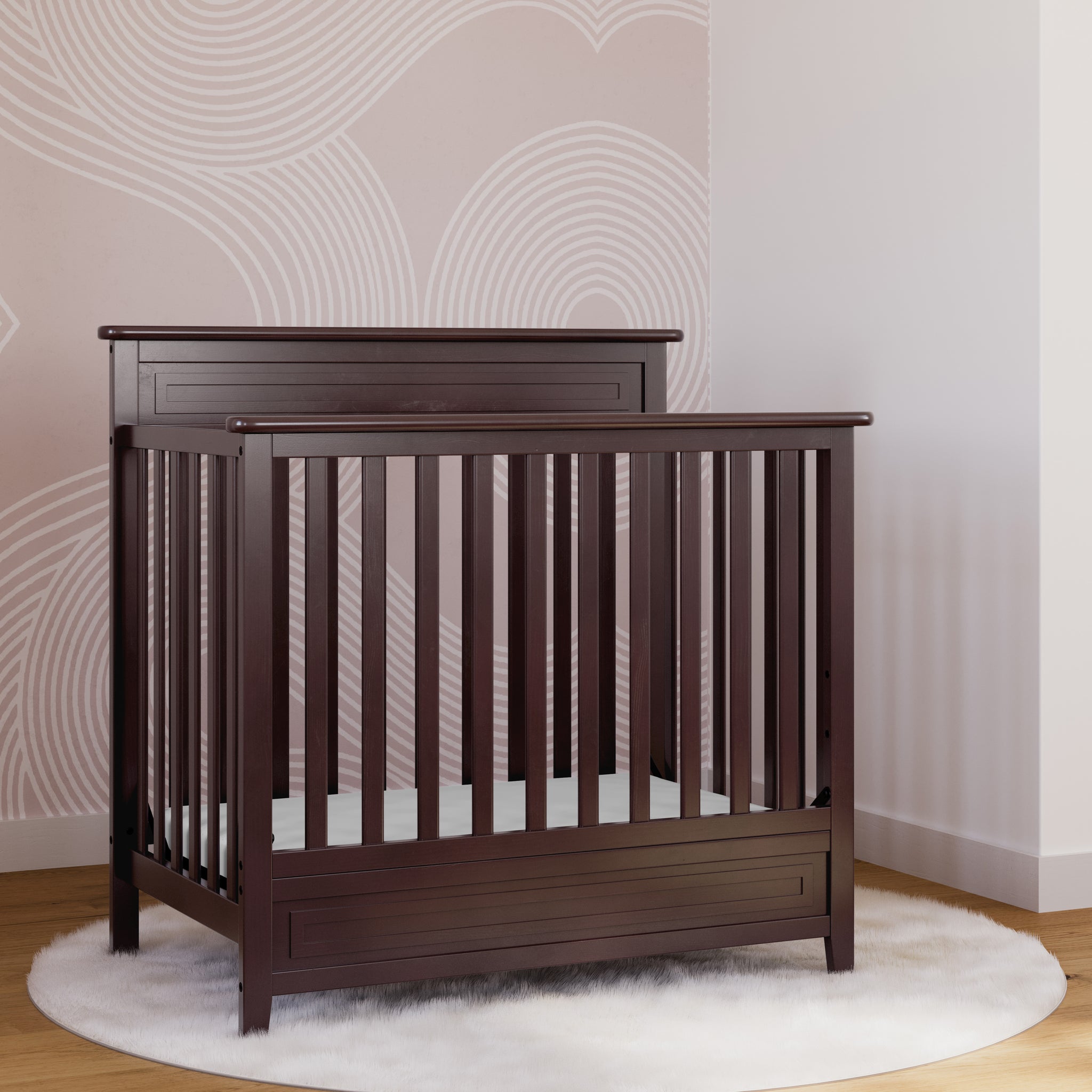 espresso mini crib in nursery 