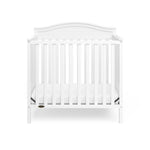 Graco® Stella 4-in-1 Convertible Mini Crib with Bonus Water-Resistant Mattress.