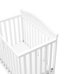 Graco® Stella 4-in-1 Convertible Mini Crib with Bonus Water-Resistant Mattress.