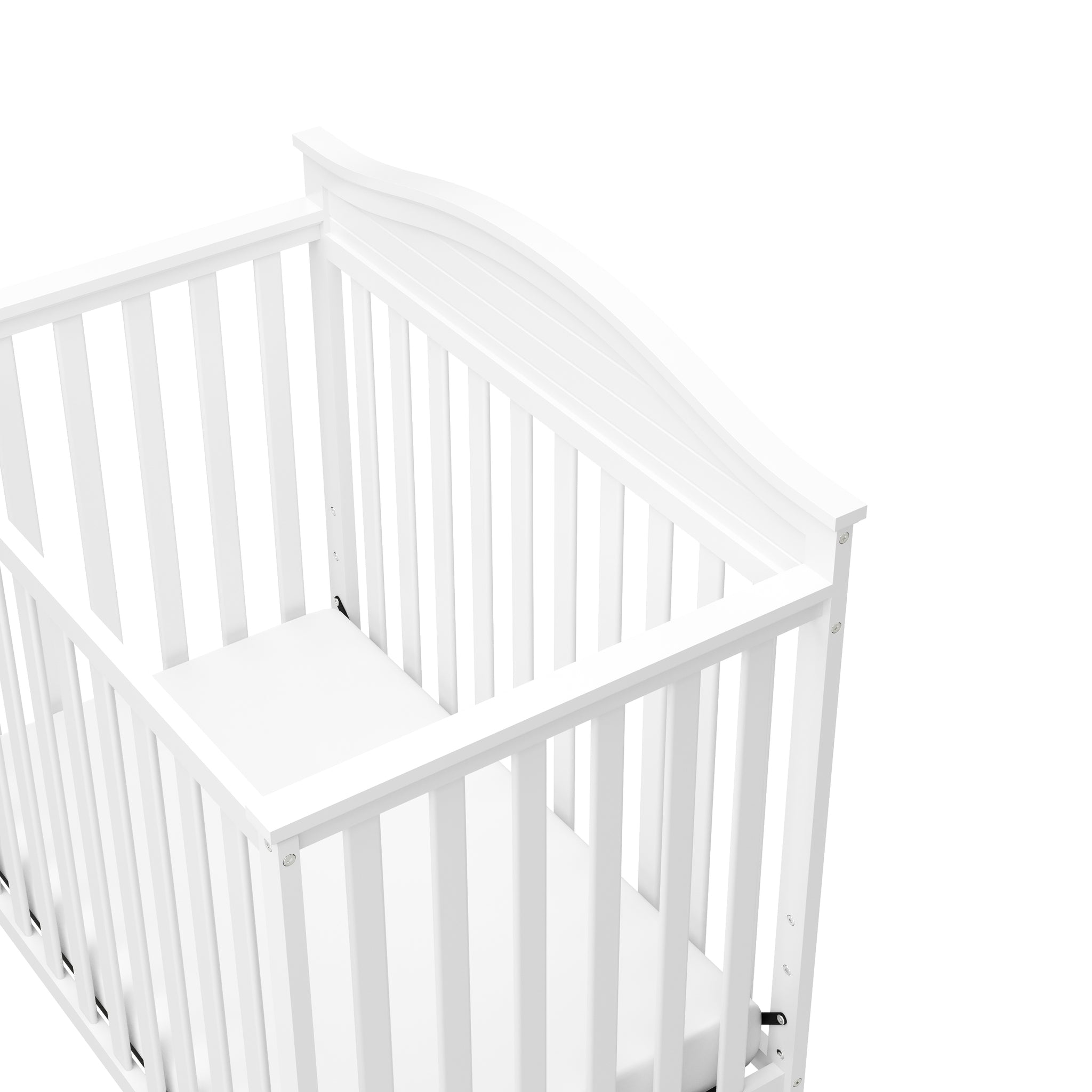 Close-up view of white crib's headboard