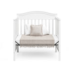 Graco® Stella 4-in-1 Convertible Mini Crib with Bonus Water-Resistant Mattress.