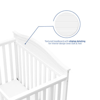 White crib features graphic