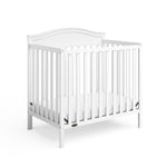 Graco® Stella 4-in-1 Convertible Mini Crib with Bonus Water-Resistant Mattress.