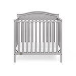 Graco® Stella 4-in-1 Convertible Mini Crib with Bonus Water-Resistant Mattress.