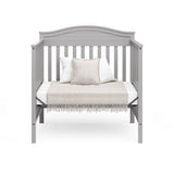 Graco® Stella 4-in-1 Convertible Mini Crib with Bonus Water-Resistant Mattress.