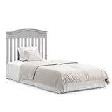 Graco® Stella 4-in-1 Convertible Mini Crib with Bonus Water-Resistant Mattress.