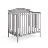 Graco® Stella 4-in-1 Convertible Mini Crib with Bonus Water-Resistant Mattress.