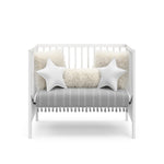 white mini crib in daybed conversion