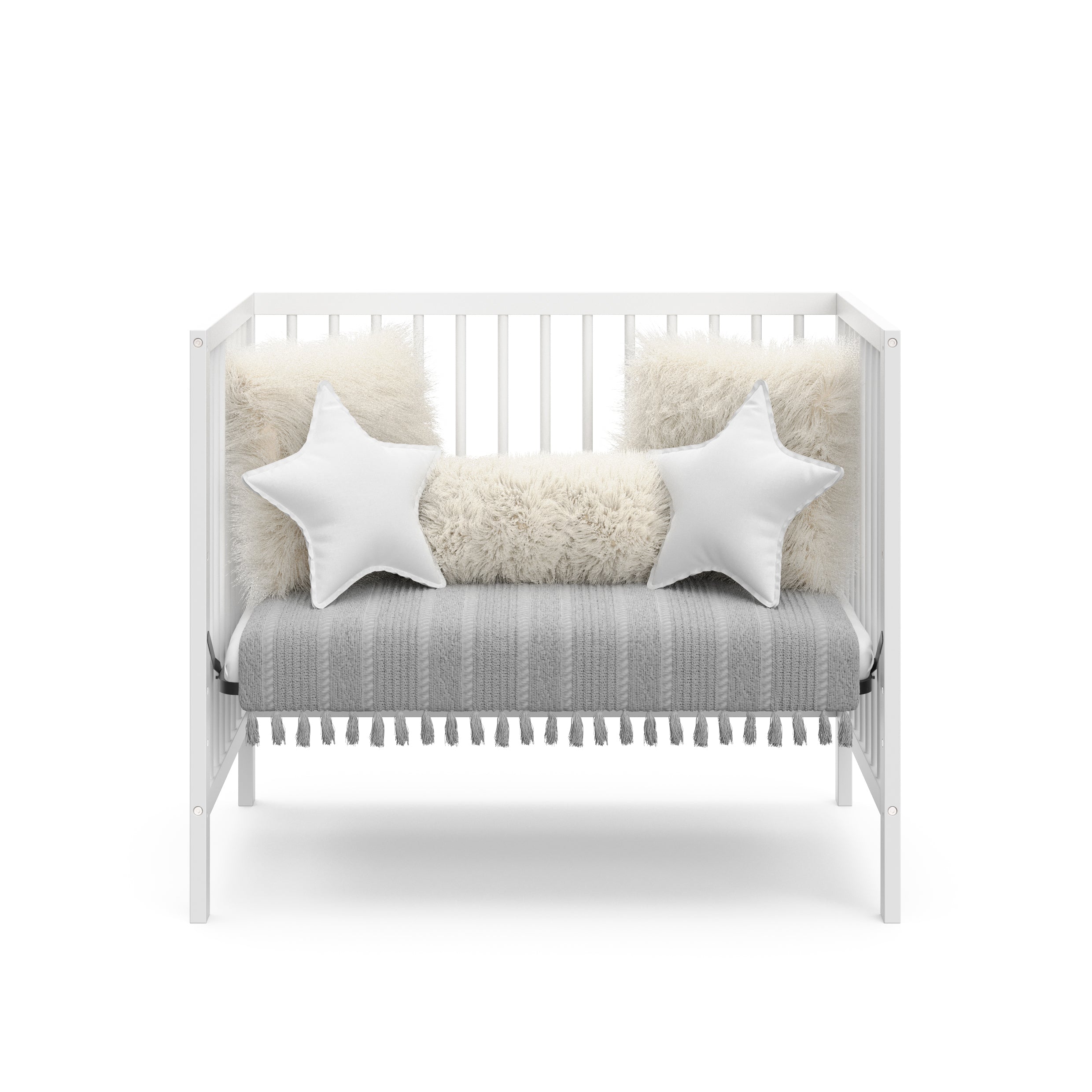 white mini crib in daybed conversion