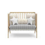 Graco® Teddi® 4-in-1 Convertible Mini Crib with Bonus Water-Resistant Mattress.