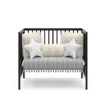 Graco® Teddi® 4-in-1 Convertible Mini Crib with Bonus Water-Resistant Mattress.