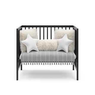 black mini crib in daybed conversion