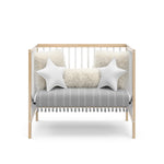 Graco® Teddi® 4-in-1 Convertible Mini Crib with Bonus Water-Resistant Mattress.