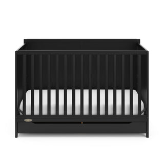 front view of black crib with drawer