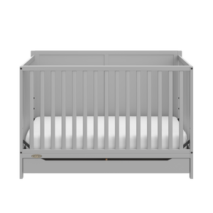 front view of pebble gray crib with drawer