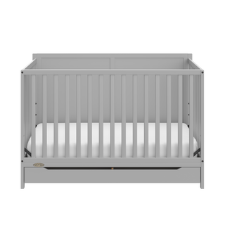 front view of pebble gray crib with drawer