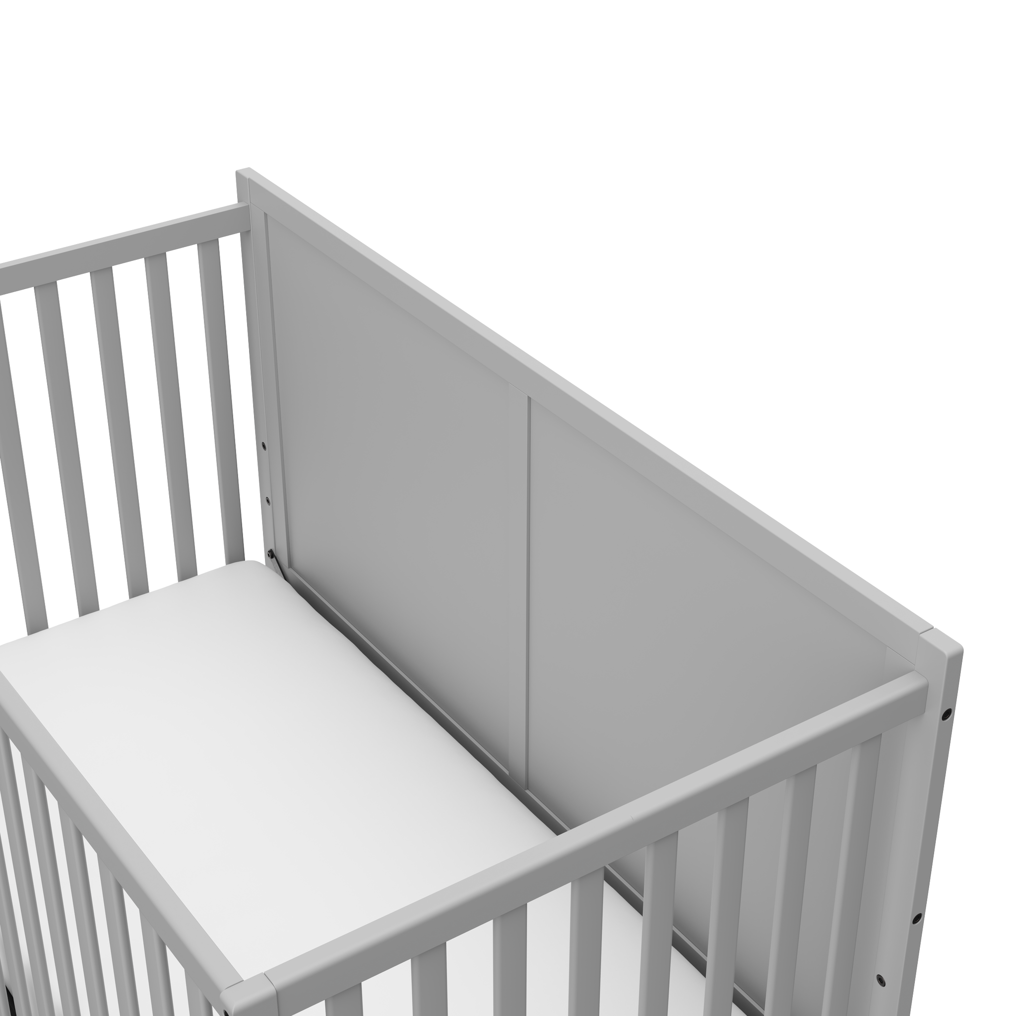 close-up view of pebble gray crib with drawer's headboard