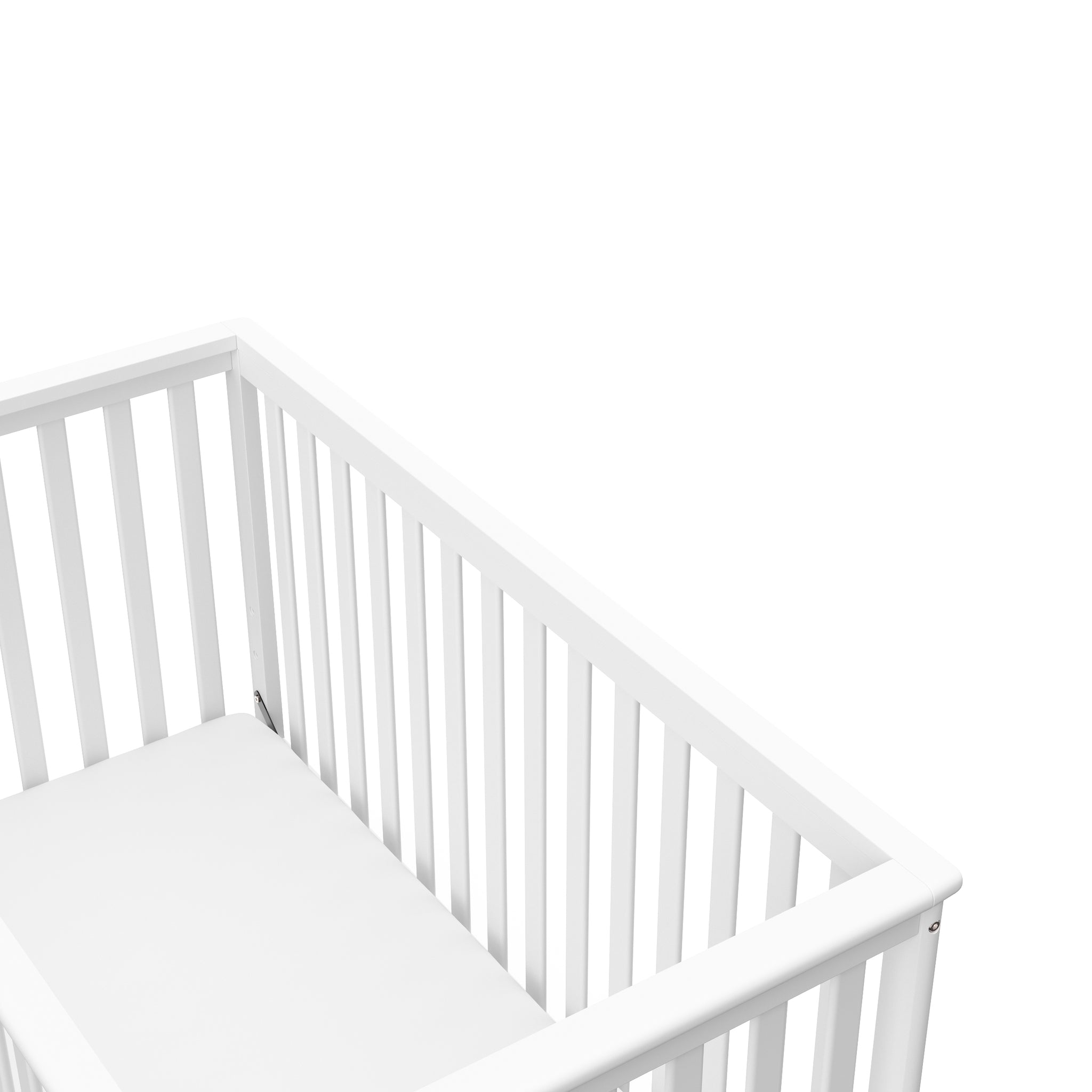 Close-up view of white crib's headboard