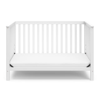 White crib in toddler bed conversion