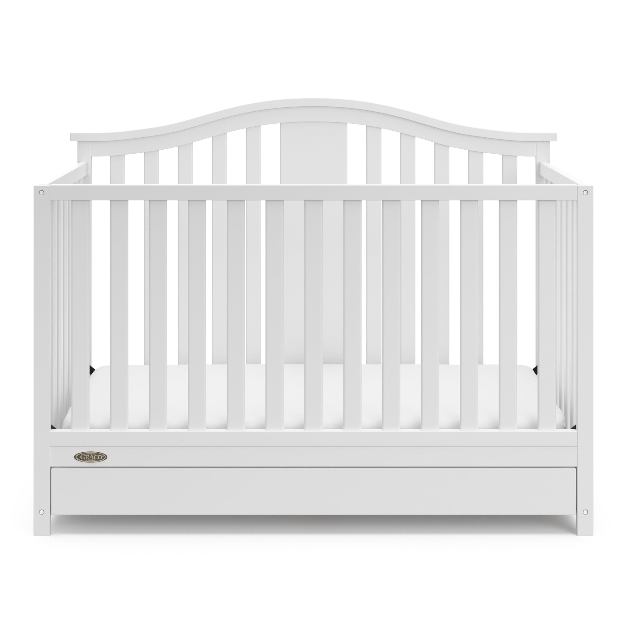 Front view of white crib with drawer