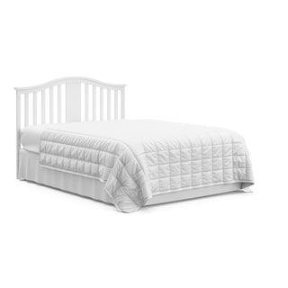 White crib with drawer in full-size bed with headboard conversion