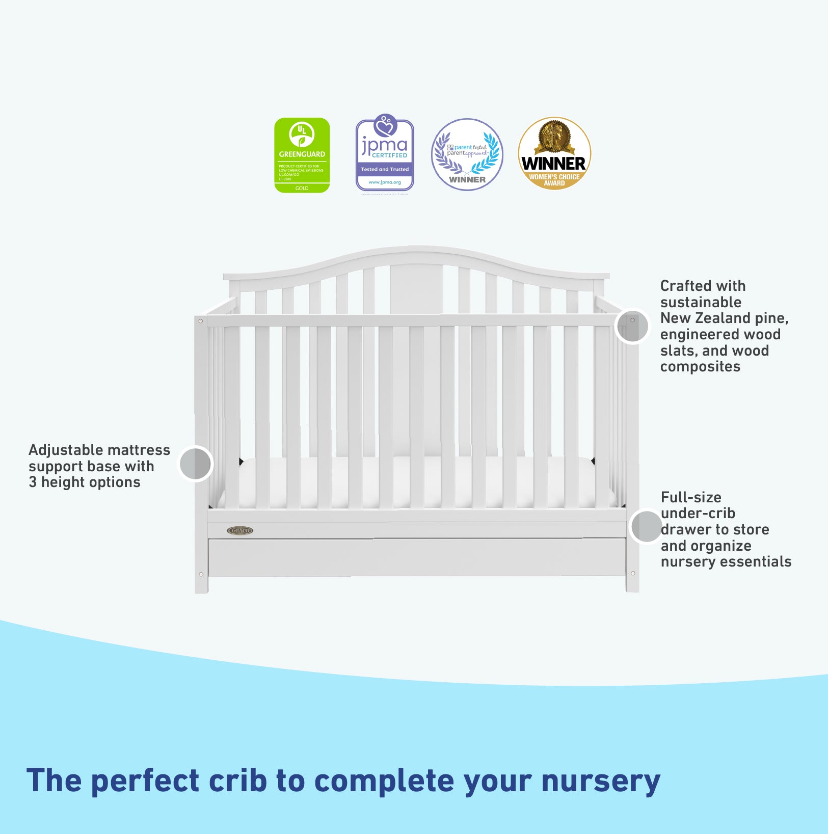 White crib with drawer features graphic