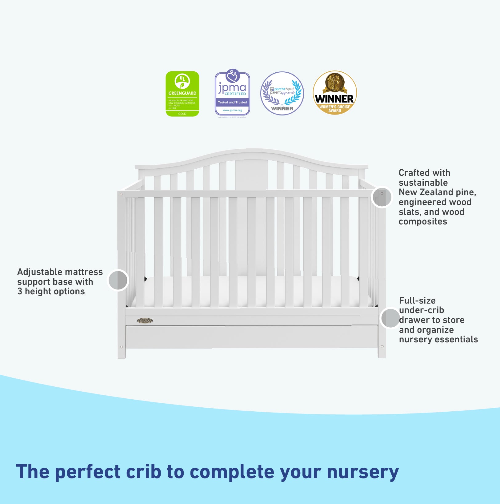 White crib with drawer features graphic