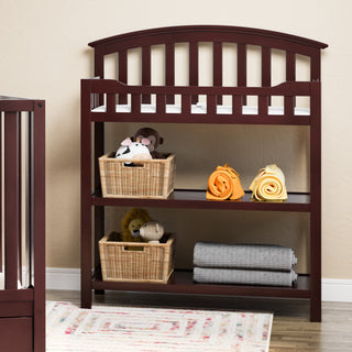 espresso changing table with two open shelves in nursery 