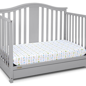 Pebble gray crib with drawer in toddler bed conversion