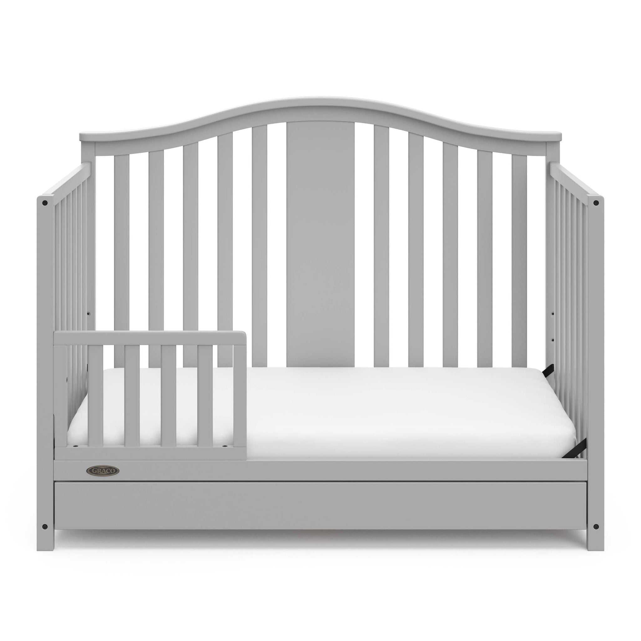 Pebble gray crib with drawer in toddler bed conversion with one safety guardrail