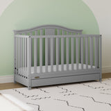Pebble gray crib with drawer in nursery