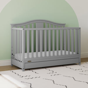 Pebble gray crib with drawer in nursery