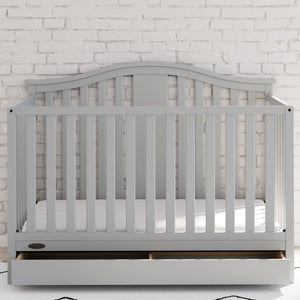 Pebble gray crib with drawer in nursery