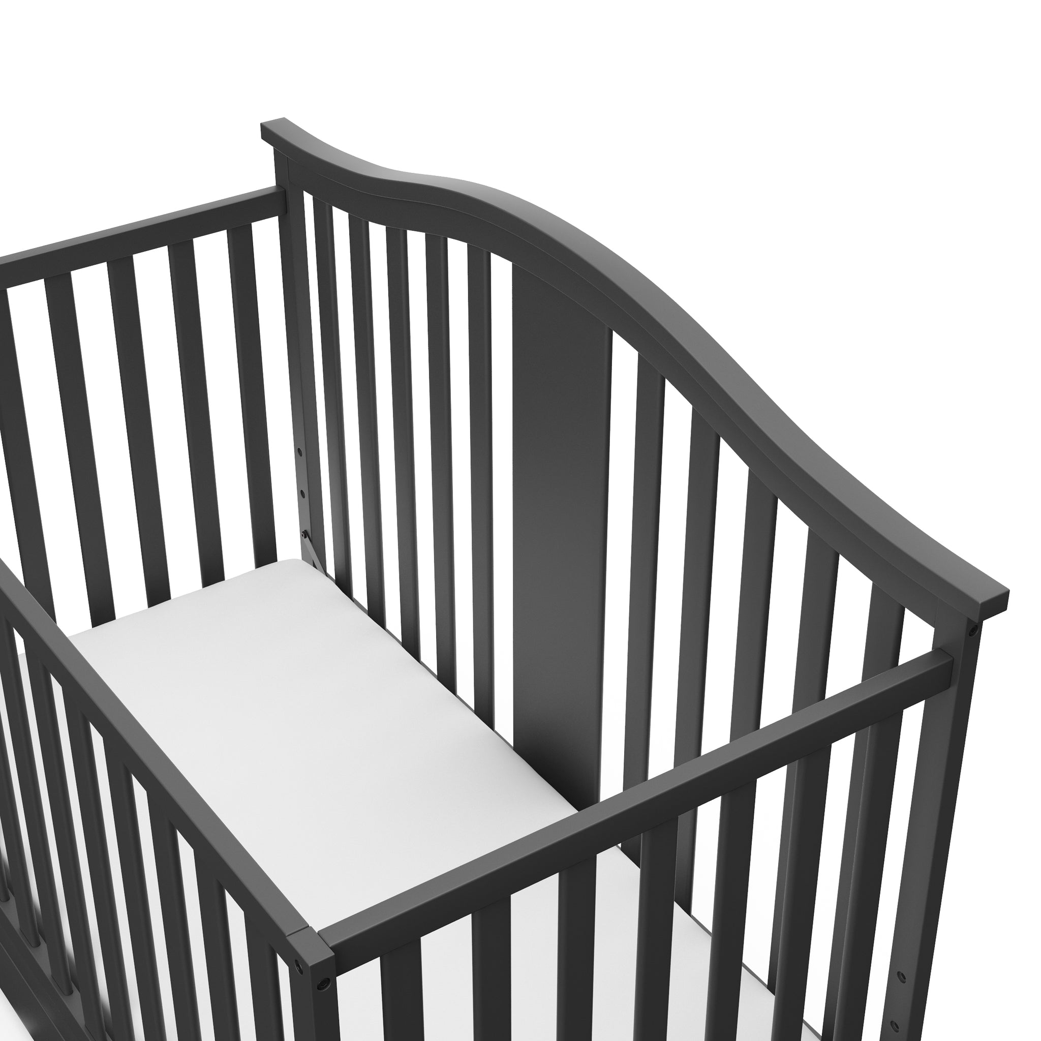 Close-up view of gray crib with drawer