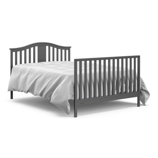 gray crib with drawer in full-size bed with headboard and footboard conversion