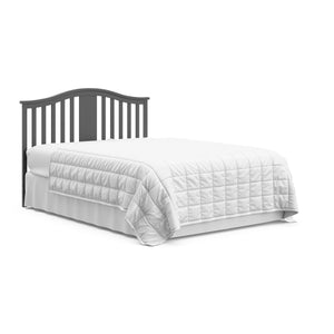 gray crib with drawer in full-size bed with headboard conversion