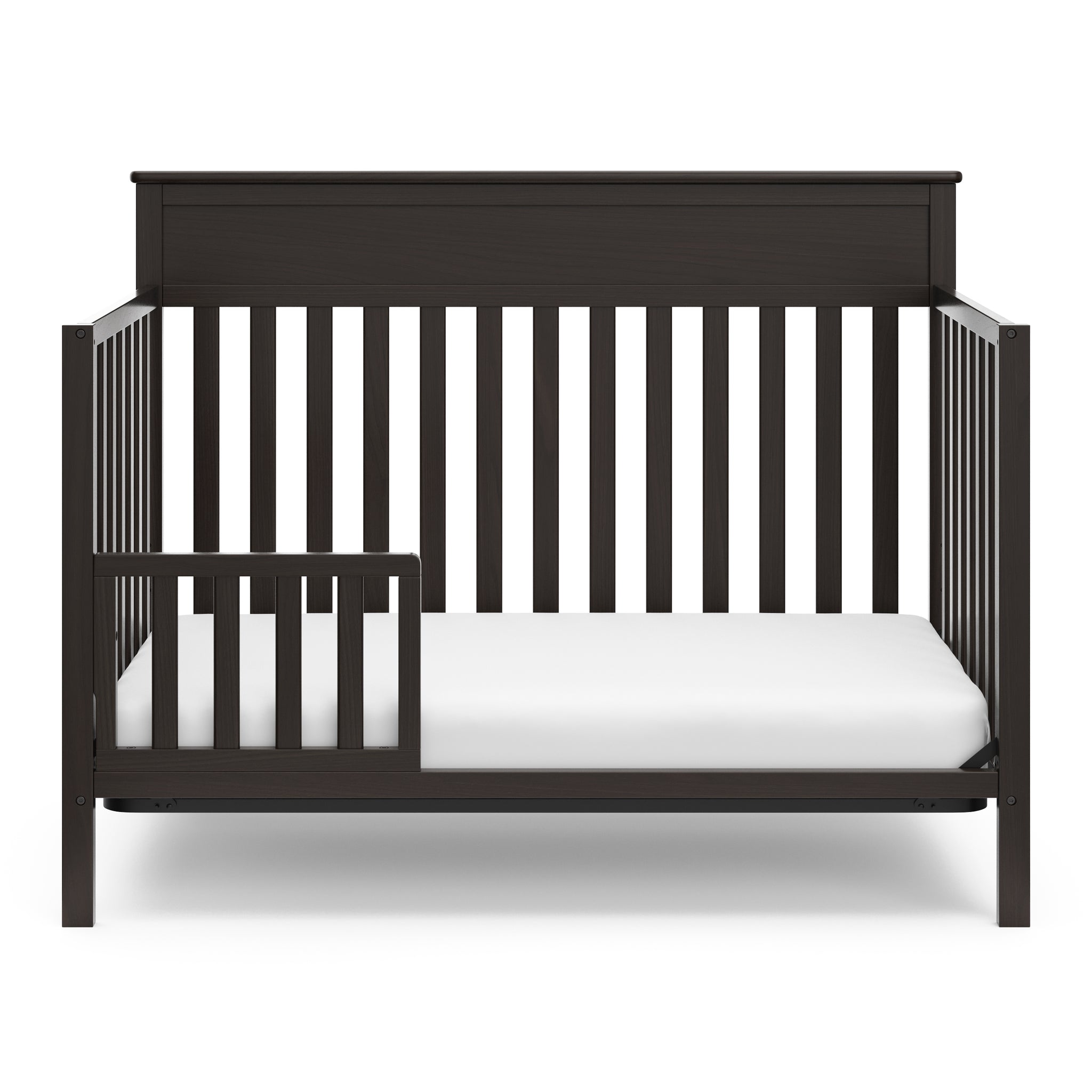 chocolate crib in toddler bed conversion with one safety guardrail