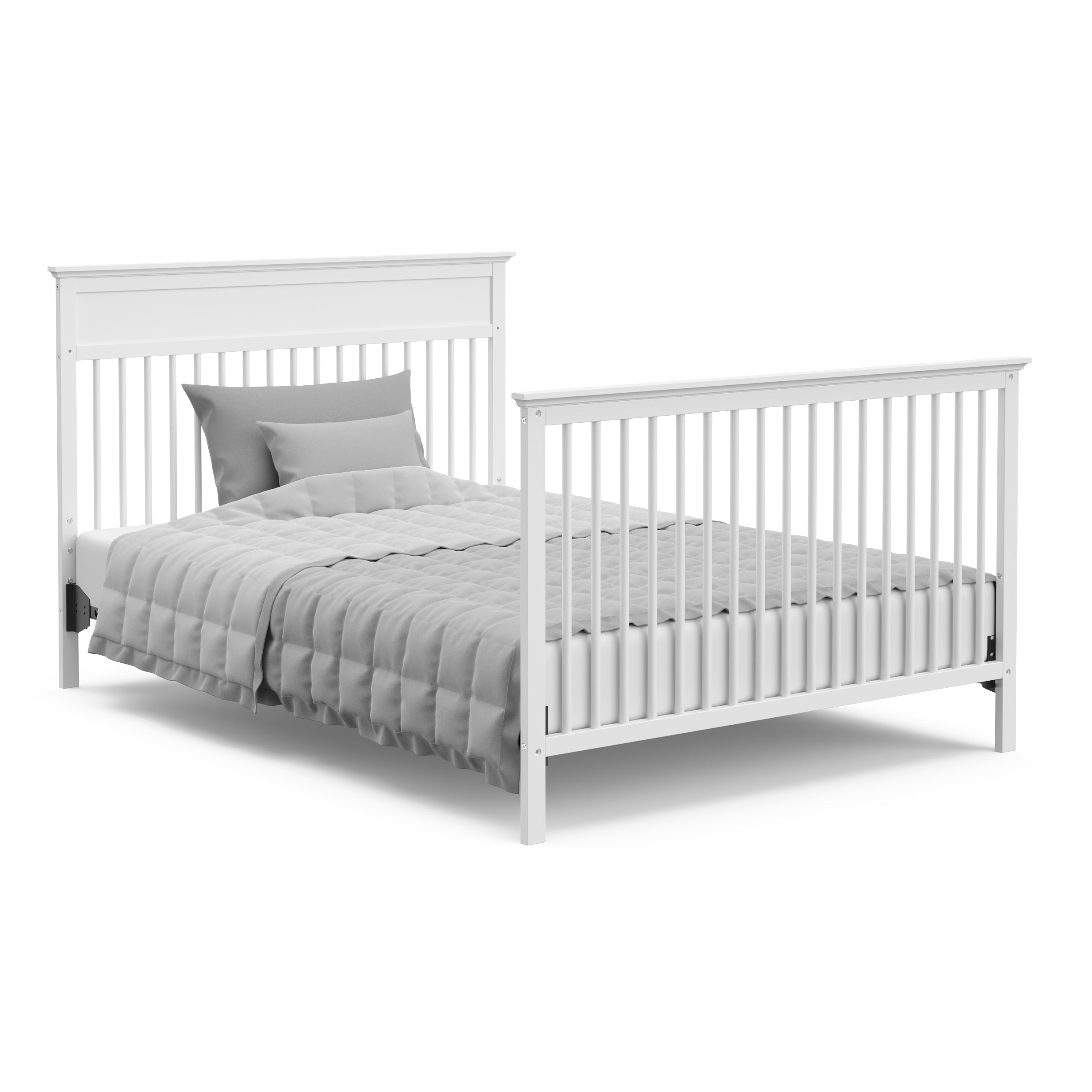 White crib in full-size bed with headboard and footboard conversion