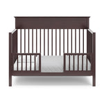espresso crib in toddler bed conversion with two safety guardrails
