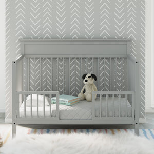 pebble gray Toddler Safety Guardrail Kit with dowels applied in toddler bed, in nursery