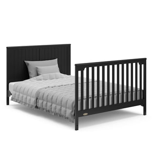 black crib with drawer in full-size bed with headboard and footboard converison